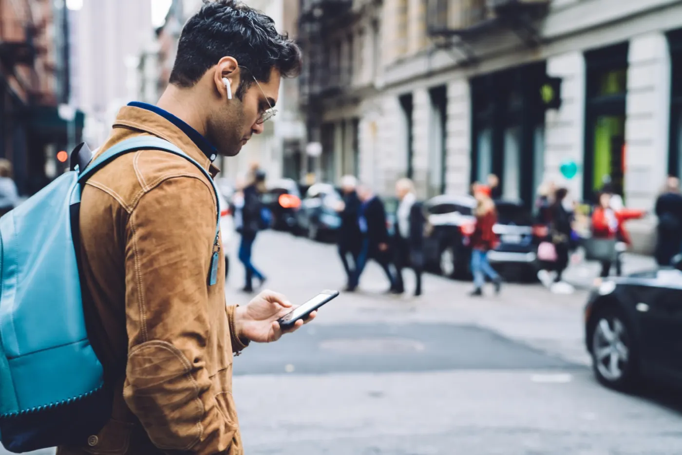 A traveller in the city with their phone